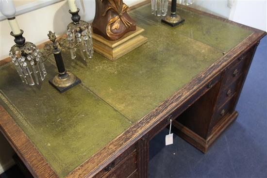 A late Victorian oak desk by Gillow, 3ft x 2ft 6in.